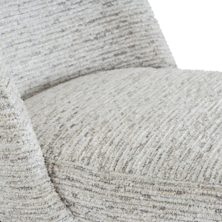 Close-up of textured beige fabric with a subtle pattern