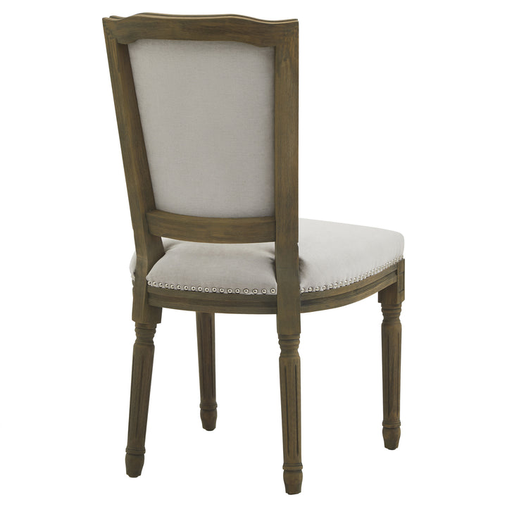 Wooden chair with white cushioned seat and backrest on a white background