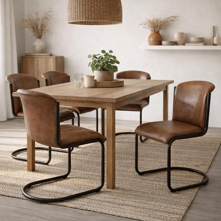 Dining room with wooden table and brown chairs on a rug