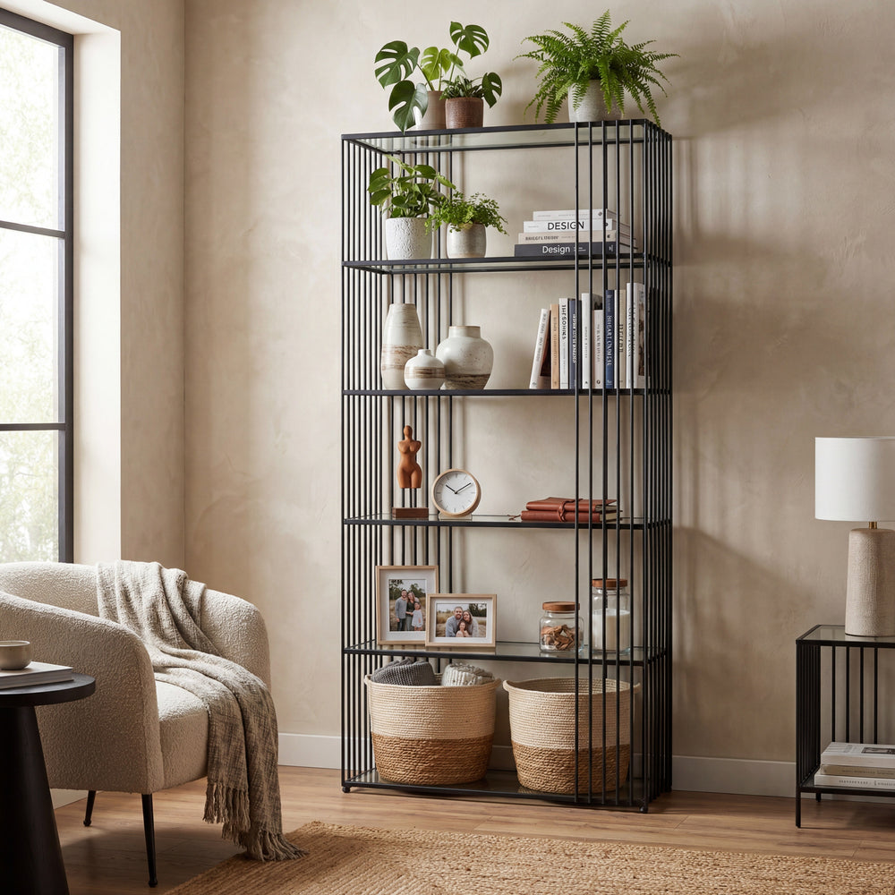 Black metal bookshelf with decorative items in a living room setting