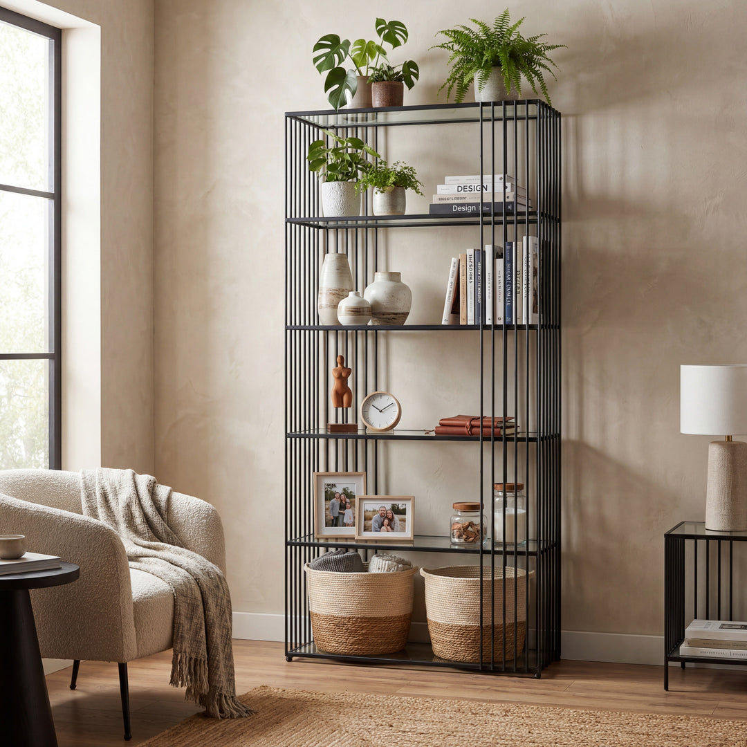 Black metal bookshelf with decorative items in a living room setting