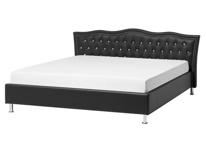 Black bed frame with studded details on a white background