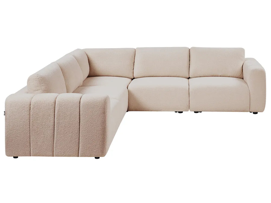 Beige sectional sofa on a white background