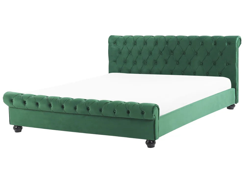 Gray tufted bed with white mattress on a white background