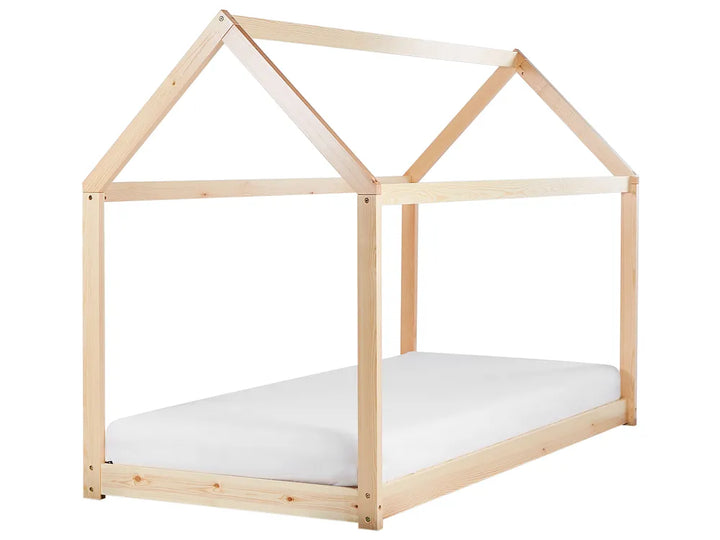 Wooden children's bed with a house design on a white background
