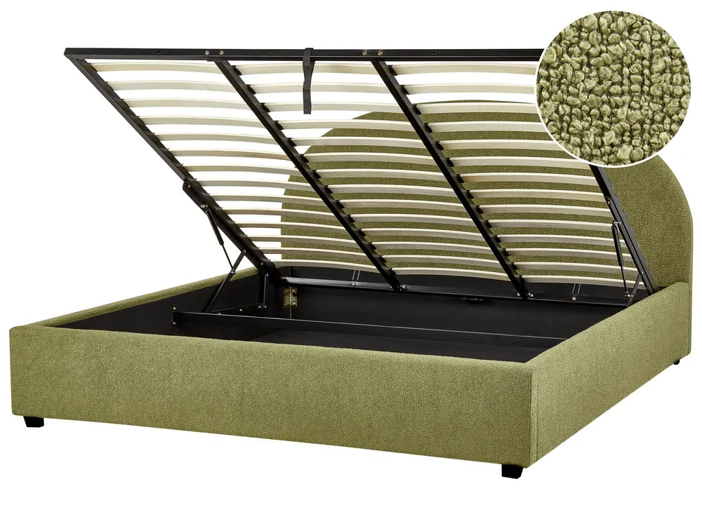 Green upholstered bed with metal frame and storage compartment on a white background