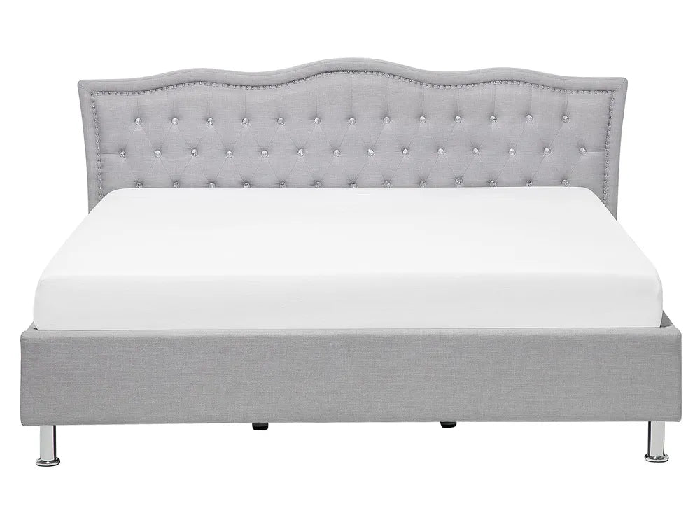 Gray upholstered bed with tufted headboard on a white background
