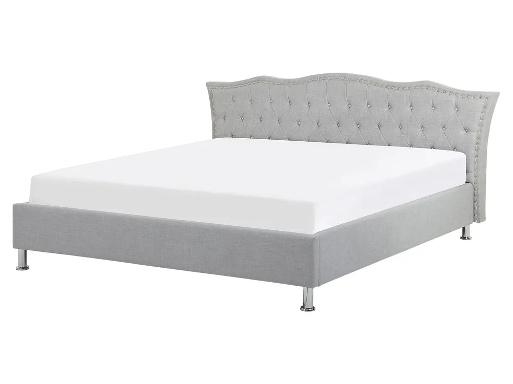 Gray upholstered bed with tufted headboard on a white background