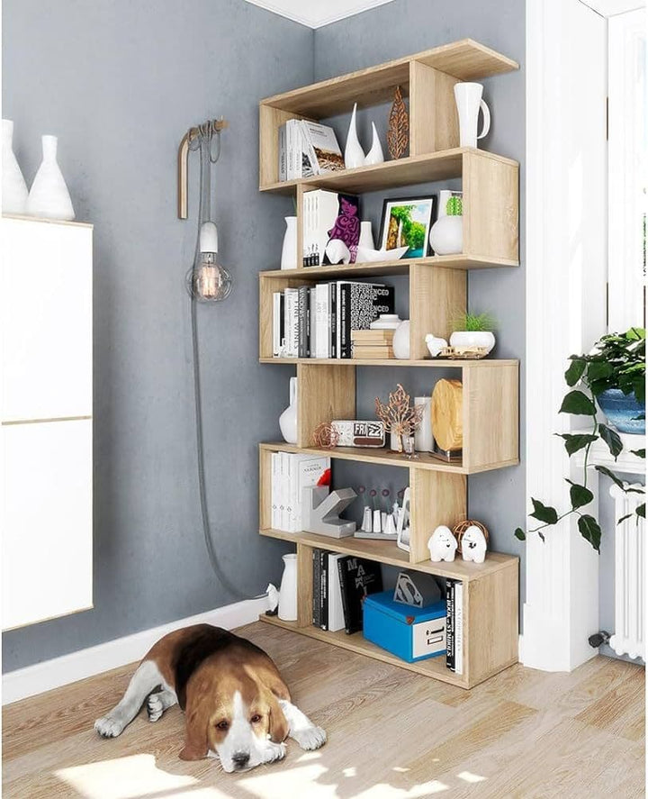 Wooden bookshelf with decorative items in a room with a dog lying on the floor.