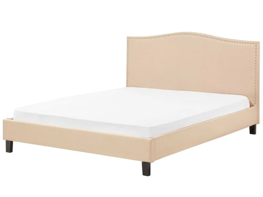 Beige upholstered bed with white mattress on a white background