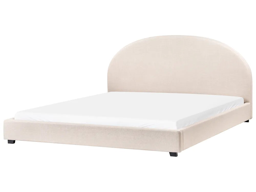 Beige upholstered bed with white mattress on a white background