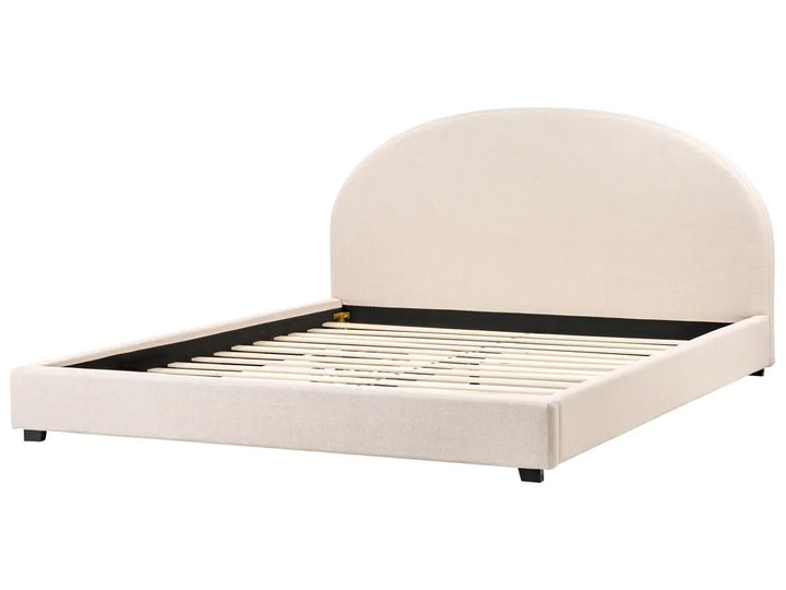 Beige upholstered bed frame on a white background