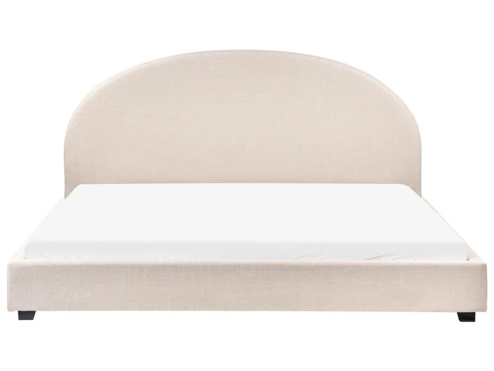 Beige upholstered bed with white mattress on a white background