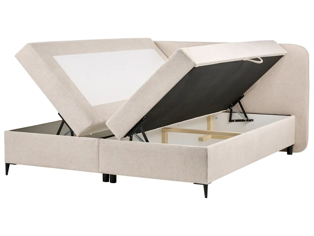 Beige upholstered bed with storage compartment on a white background