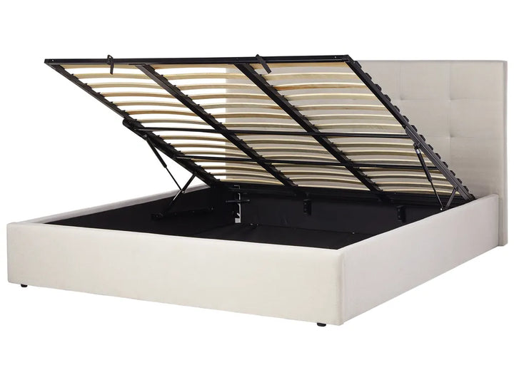 White bed frame with black metal slats on a white background
