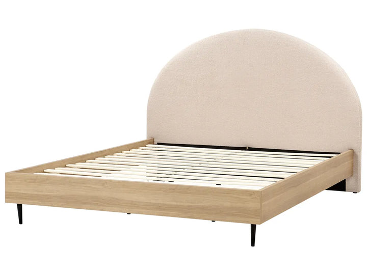 Beige upholstered bed frame with wooden slats on a white background