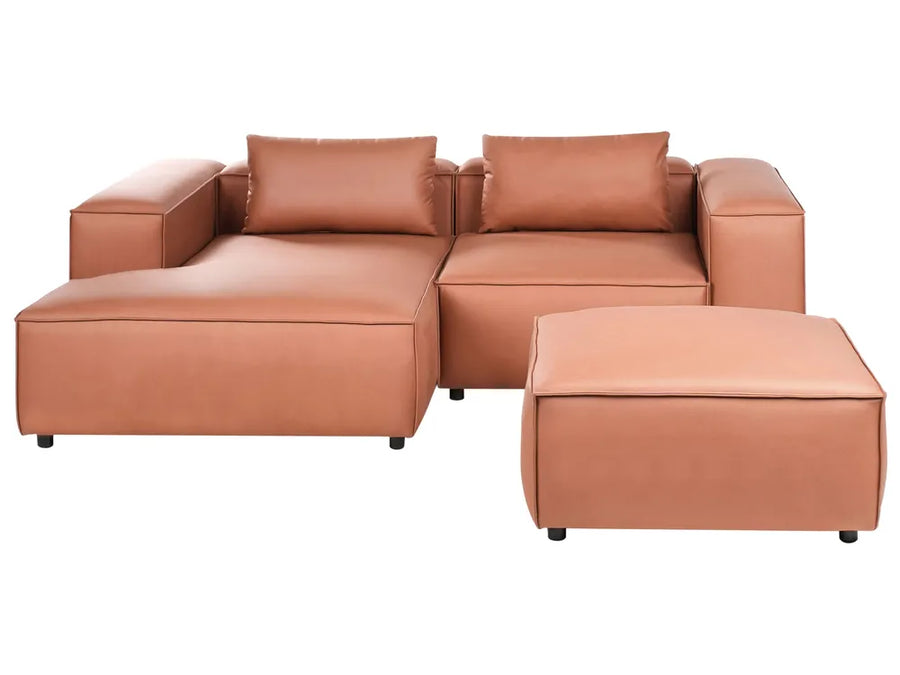 Brown leather sectional sofa with ottoman on a white background