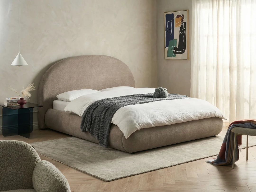 King size taupe ottoman bed with lift-up storage and upholstered headboard