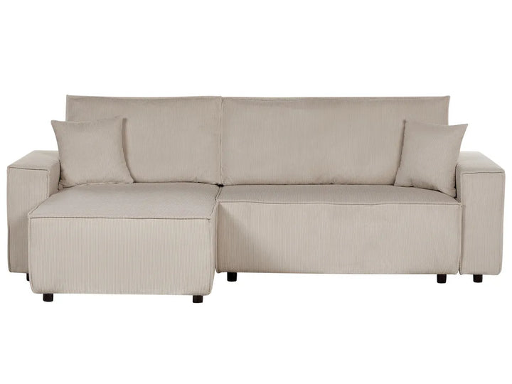 Beige sectional sofa with cushions on a white background