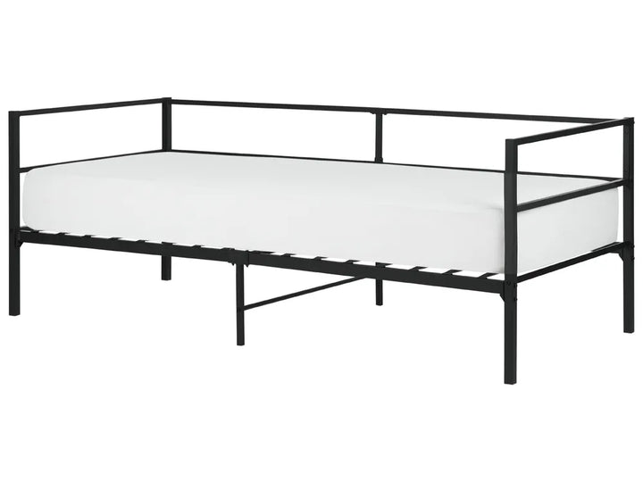 Black metal bed frame with white mattress on a white background
