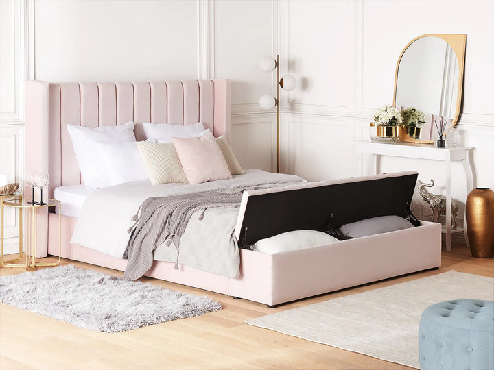 pink velvet bed with winged headboard and bench