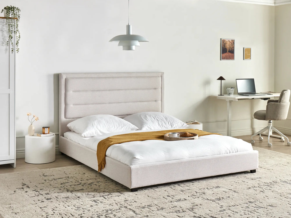 Modern bedroom with a bed, desk, and chair.