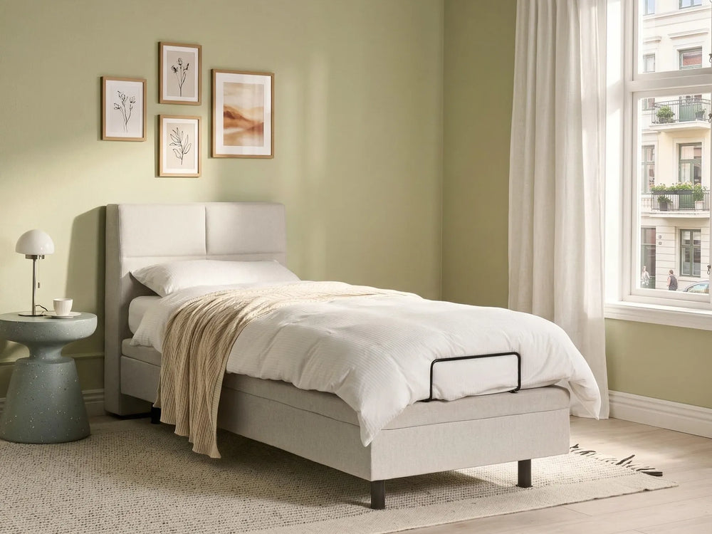 Single adjustable bed with fabric upholstery and motorised base