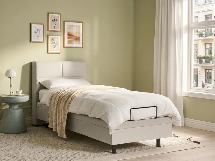 Single adjustable bed with fabric upholstery and motorised base