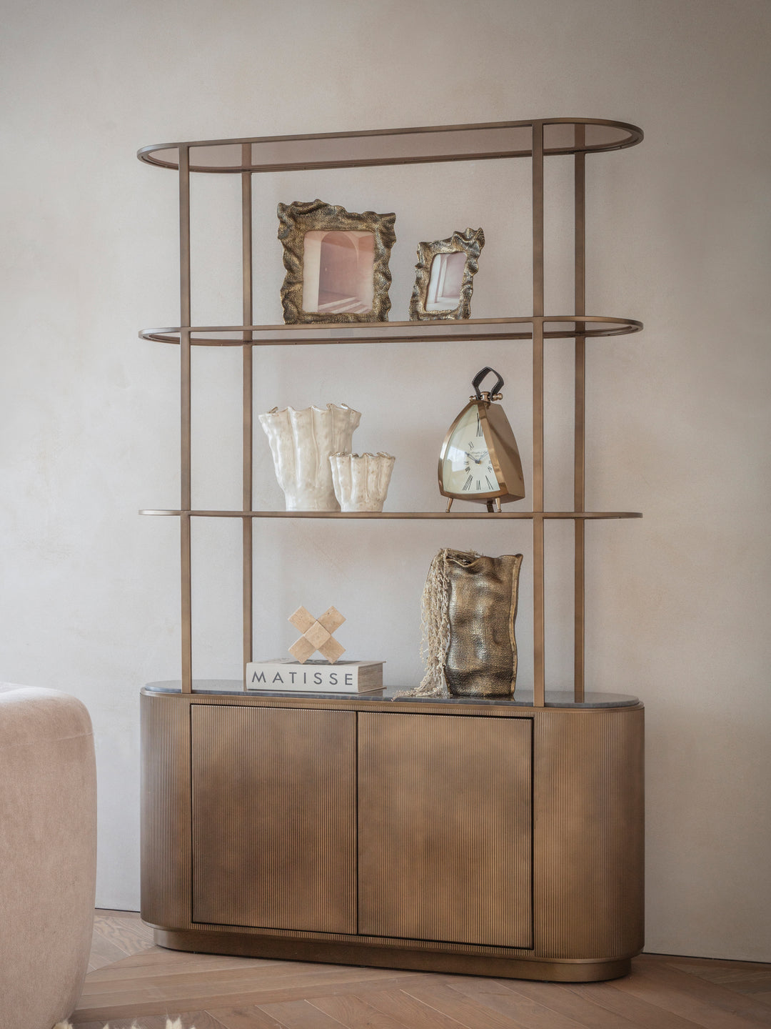 Luxury shelving unit with smoked gold frame and glass shelves