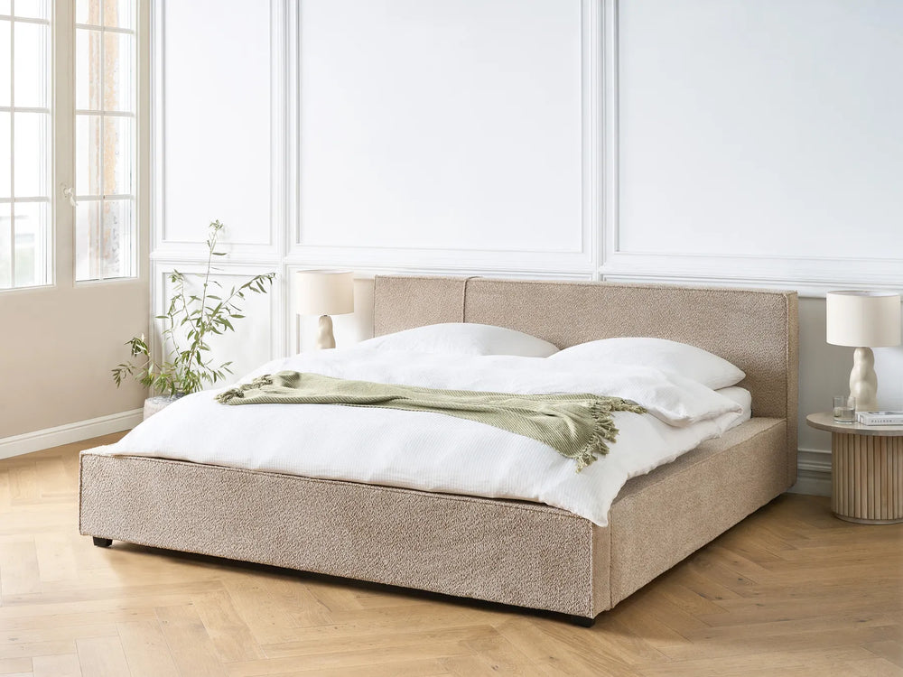 Modern bouclé bed with soft textured fabric