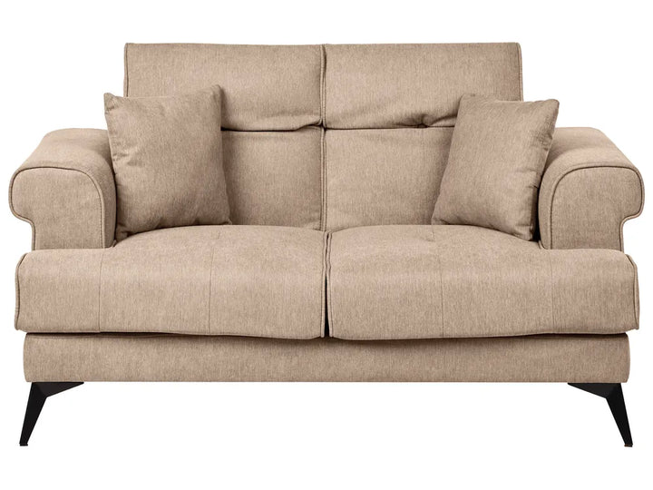 Beige sofa with three cushions on a white background