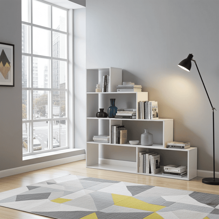Modern room interior with a bookshelf, lamp, and geometric rug.