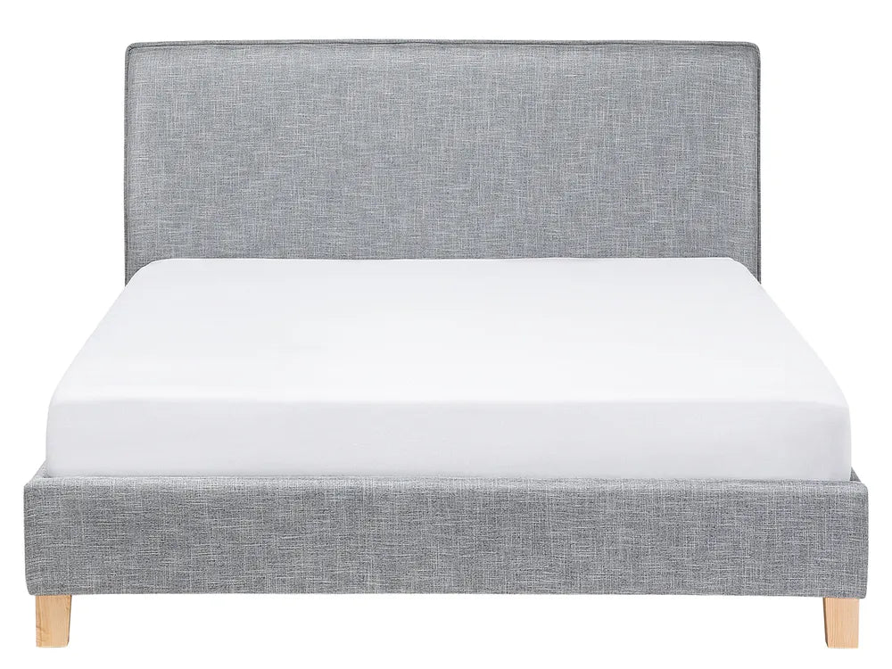 EU king bed with tall grey fabric headboard