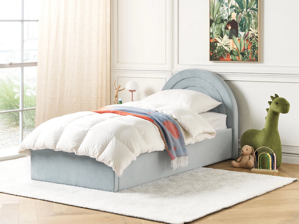 Children's bedroom with a gray bed, colorful blanket, and toys.