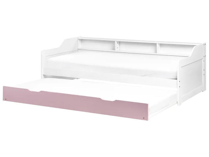 White bed frame with pink footboard on a white background