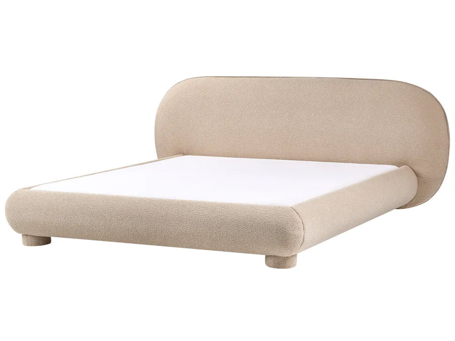 Beige upholstered bed with white mattress on a white background