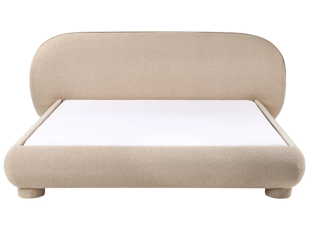 Beige upholstered bed with white mattress on a white background