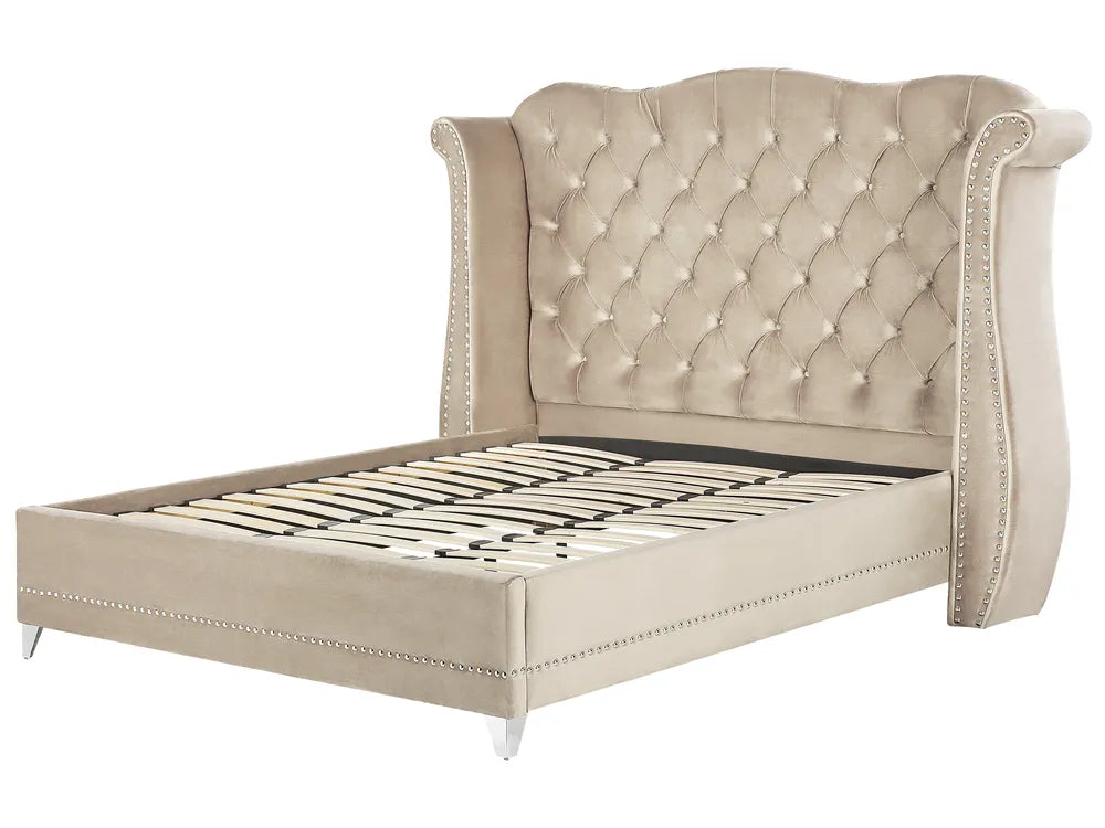 Beige upholstered bed with tufted headboard on a white background