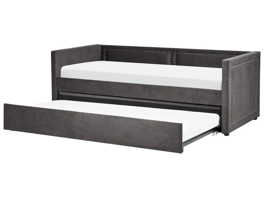 Gray upholstered bed with a white mattress on a white background