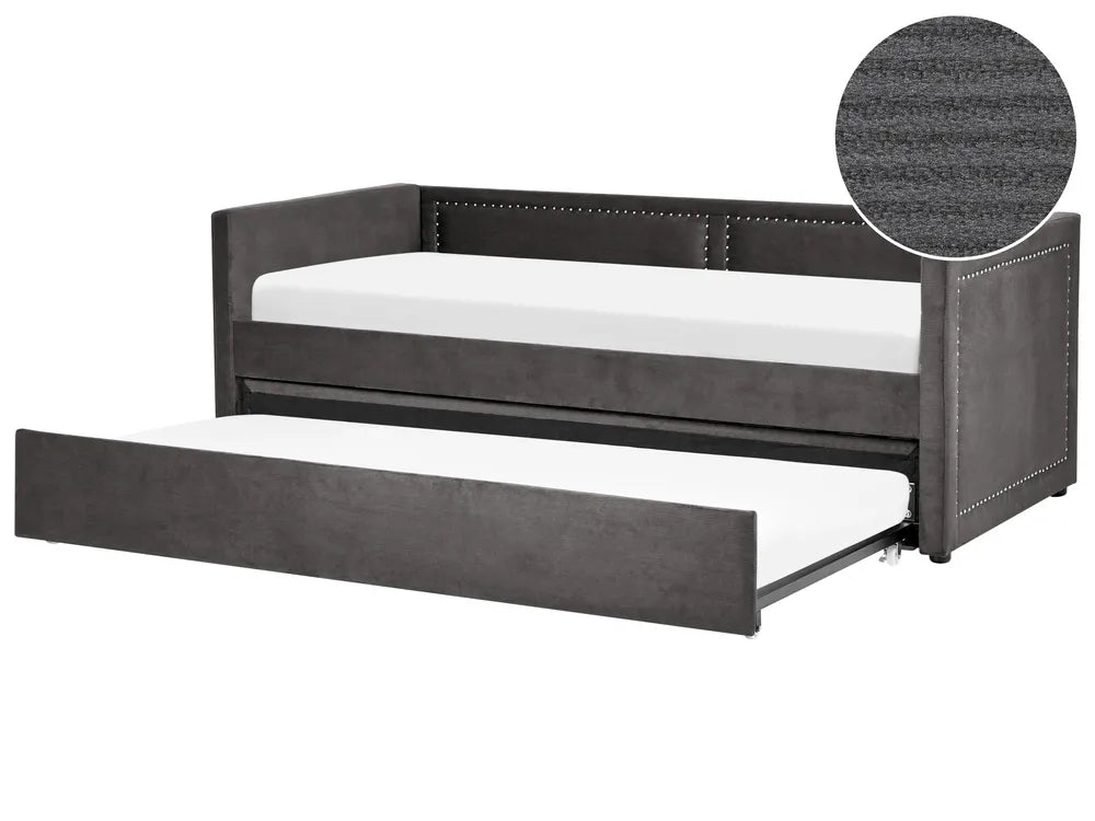 Gray upholstered bed with a white mattress on a white background