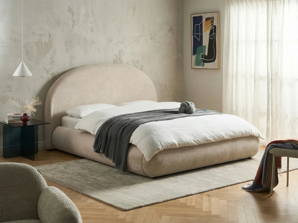 King size light beige ottoman bed with lift-up storage and rounded headboard