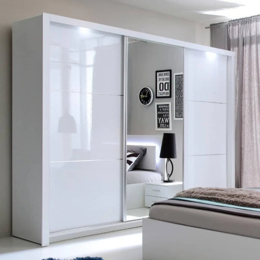 White wardrobe with mirror in a bedroom setting