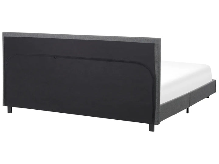 Black bed frame with white mattress on a white background