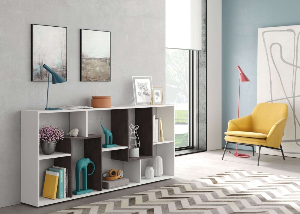 Modern living room with a white bookshelf, yellow armchair, and abstract art.