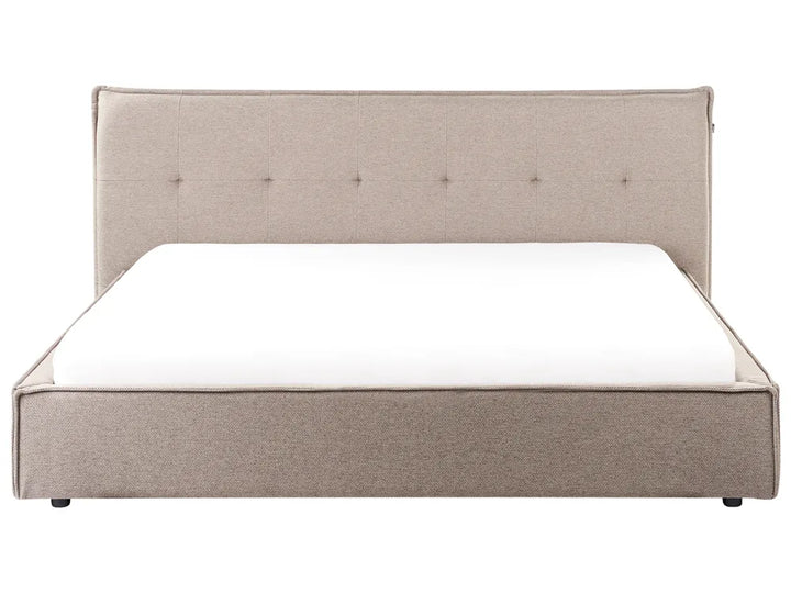 Beige upholstered bed with a white mattress on a white background