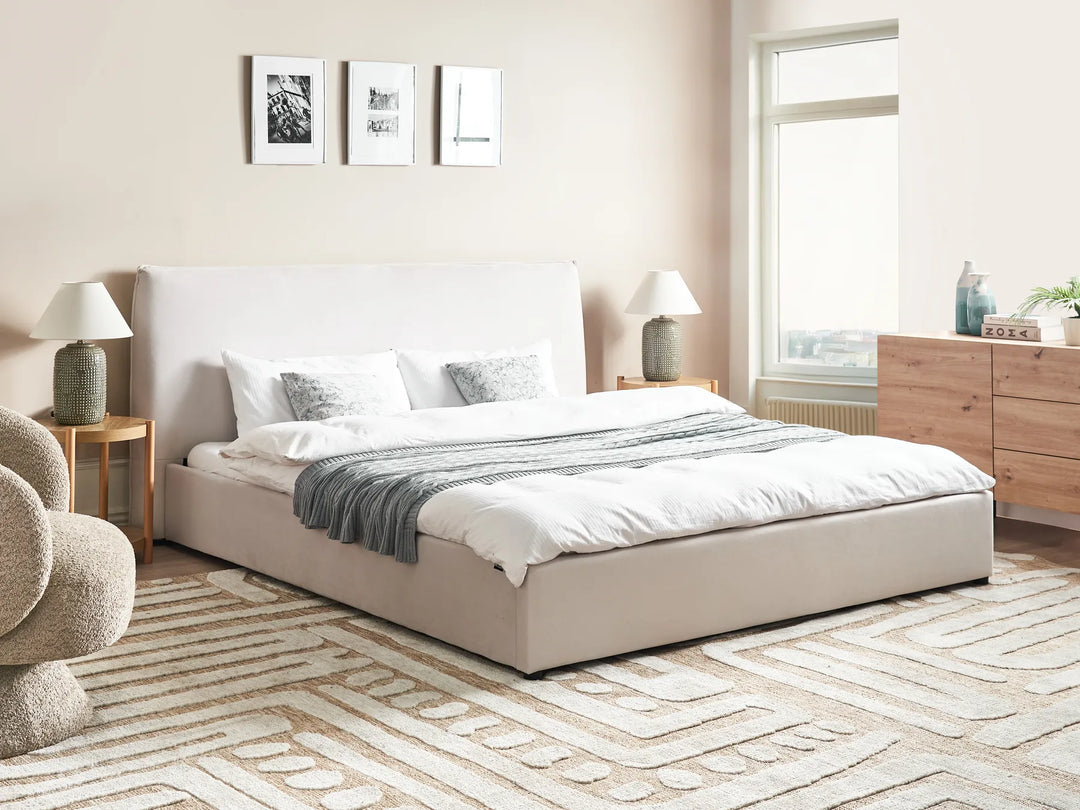 Neatly made bed in a modern bedroom with neutral decor