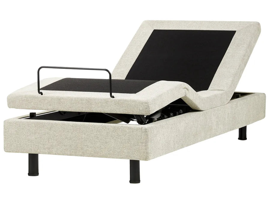 Beige adjustable bed base with black control panel on a white background