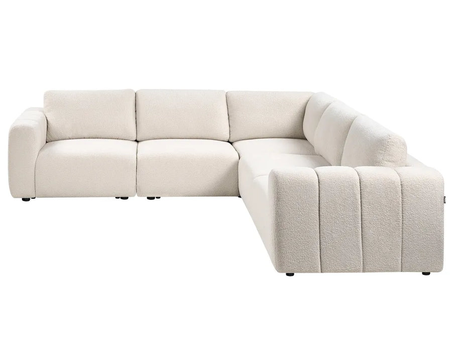 Beige sectional sofa on a white background