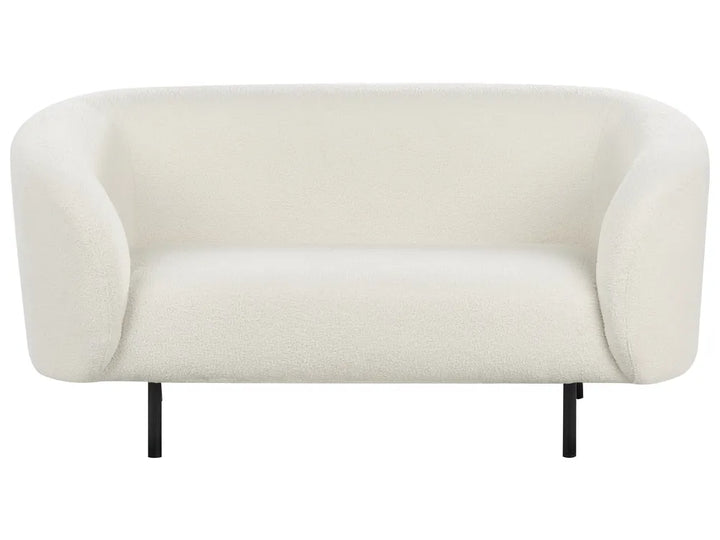 Beige sofa with black legs on a white background