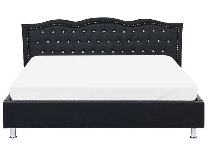 Upholstered bed with silver button detailing